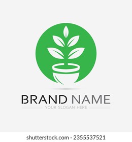 Gardening logo with shovel icon and tree with green leaves logo template.