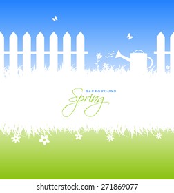 It's gardening time. Spring garden background concept with fence, sprinkler and place for text.