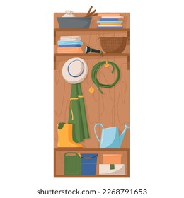 Gardening tools and clothers and on a shelf and hanging on a wooden wall