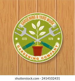 Gardening and yard work services emblem, label, patch, sticker. Vector illustration. For sign, patch, shirt design with hand garden rake, gardening equipment silhouette.