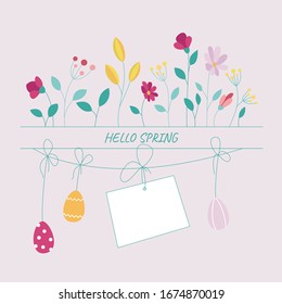 Garland of colored eggs with spring flowers. Place for text