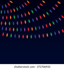 Garland of light bulbs. Festive garland from small lamps, festive garland from small multi-colored bulbs on a dark blue background