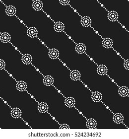 Garlands. Tiled seamless geometric pattern of dotted circles. Beads. Abstract black and white mosaic background. Vector illustration.