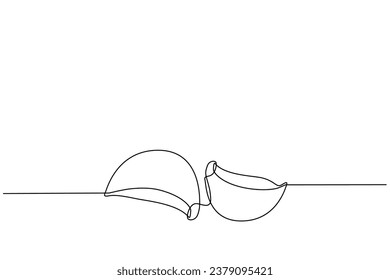 garlic accompanied by garlic slices in continuous line art drawing style. Single line concept of garlic and onion slices in doodle style on white background. Vector