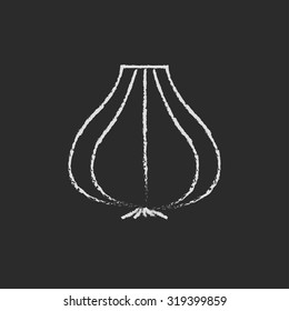 Garlic hand drawn in chalk on a blackboard vector white icon isolated on a black background.