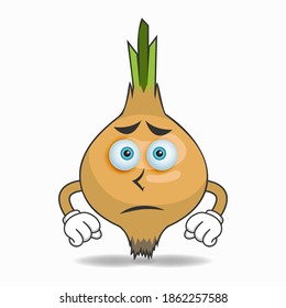 Garlic mascot character with sad expression. vector illustration