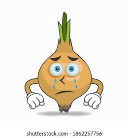 Garlic mascot character with sad expression. vector illustration