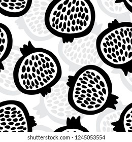 Garnet fruit hand drawn seamless pattern, scandinavian style. Vector illustration. Black pomegranate on white background. Can be used for textile, kitchen, scrapbooking.
