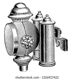 Gas lamp is a device that produces light by burning gas. Older lamps were generally large and heavy, vintage engraved line art illustration. Bicycle Accessories - 1900