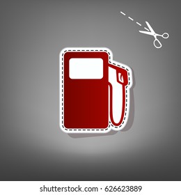 Gas pump sign. Vector. Red icon with for applique from paper with shadow on gray background with scissors.