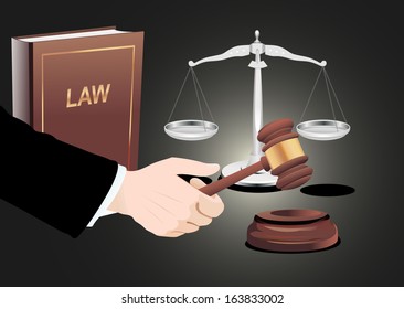 Gavel in hand, scales of justice and law book