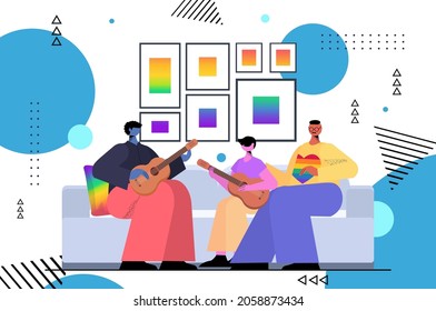 gay family playing guitar with son fatherhood transgender love LGBT community concept