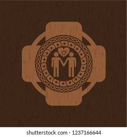 gay men love icon inside badge with wooden background