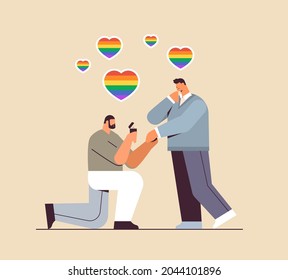 gay proposing to man down on knee with engagement ring transgender love LGBT community concept