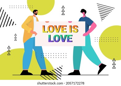 gays holding placard with rainbow love is love text LGBT parade pride festival transgender love concept