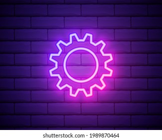 Gear, maintenance. Pink neon vector icon. Glowing gear symbol isolated on brick wall background
