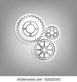 Gear mechanism sticker. Metal cogs on paper - the material icon or logo