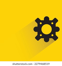 engranaje con sombra sobre fondo amarillo