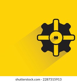 gear with shadow on yellow background