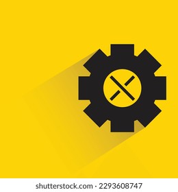 gear with shadow on yellow background
