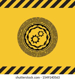 gear, team work icon black grunge emblem inside yellow warning sign. Vector Illustration. Detailed.