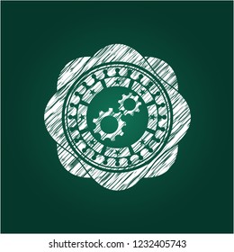 gear, team work icon drawn on blackboard