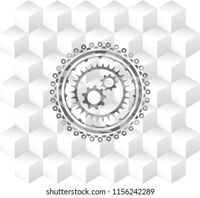 gear, team work icon inside grey badge with geometric cube white background