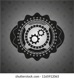 gear, team work icon inside dark badge or emblem