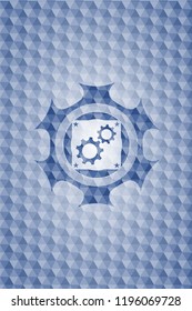 gear, team work icon inside blue emblem or badge with abstract geometric polygonal pattern background.