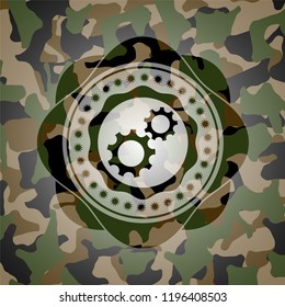 gear, team work icon inside camouflaged emblem