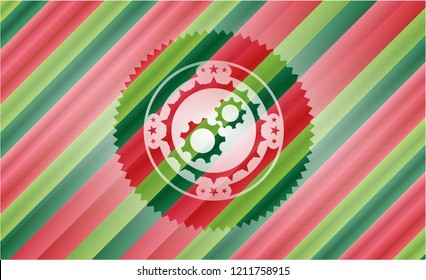gear, team work icon inside christmas colors badge.