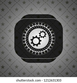 gear, team work icon inside black badge