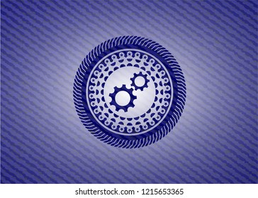 gear, team work icon inside badge with jean texture