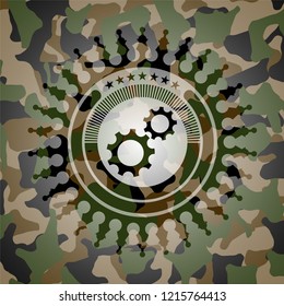 gear, team work icon inside camo emblem