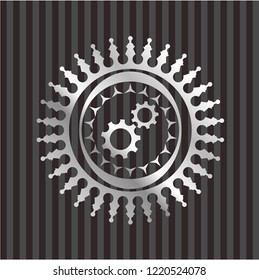 gear, team work icon inside silvery badge or emblem
