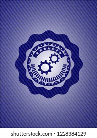 gear, team work icon inside emblem with jean background