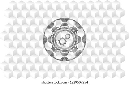gear, team work icon inside grey emblem with cube white background
