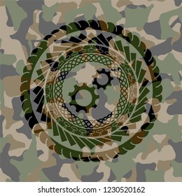 gear, team work icon inside camo texture