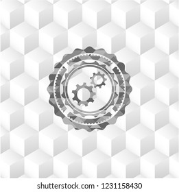 gear, team work icon inside realistic grey emblem with geometric cube white background