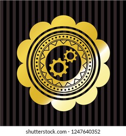 gear, team work icon inside gold emblem or badge