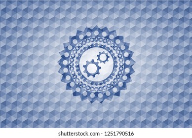 gear, team work icon inside blue emblem or badge with abstract geometric polygonal pattern background.