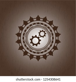 gear, team work icon inside wood emblem