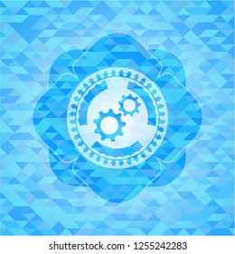 gear, team work icon inside realistic sky blue emblem. Mosaic background