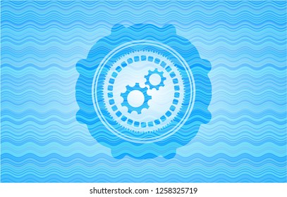 gear, team work icon inside light blue water emblem background.