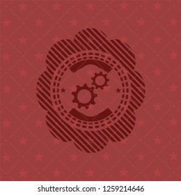 gear, team work icon inside badge with red background