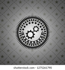 gear, team work icon inside dark badge or emblem