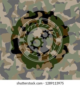 gear, team work icon inside camo texture