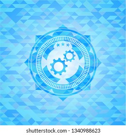 gear, team work icon inside realistic light blue mosaic emblem
