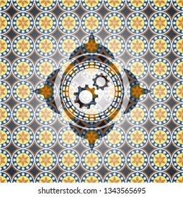 gear, team work icon inside arabic style badge. Arabesque decoration.