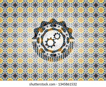 gear, team work icon inside arabesque badge background. arabic decoration.